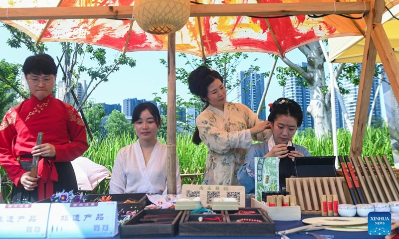 Intangible cultural heritage products are on display during an activity marking the Cultural and Natural Heritage Day in Hangzhou, east China's Zhejiang Province, June 9, 2023. Hangzhou with its rich cultural heritage and breathtaking natural beauty has established itself as a must-visit city for travel enthusiasts.(Photo: Xinhua)