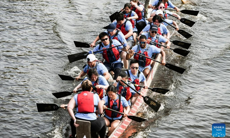 Participants compete at Boston Hong Kong Dragon Boat Festival in Cambridge, Massachusetts, the United States, on June 11, 2023. More than 60 teams took part in this event on Sunday.(Photo: Xinhua)