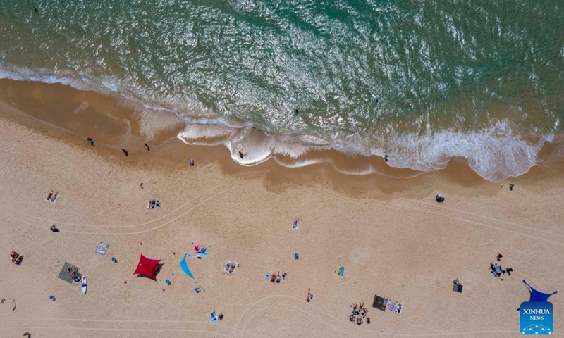 The aerial photo taken on June 7, 2023 shows people spending time at the shore of Mediterranean Sea in Rishon LeZion, Israel.(Photo: Xinhua)