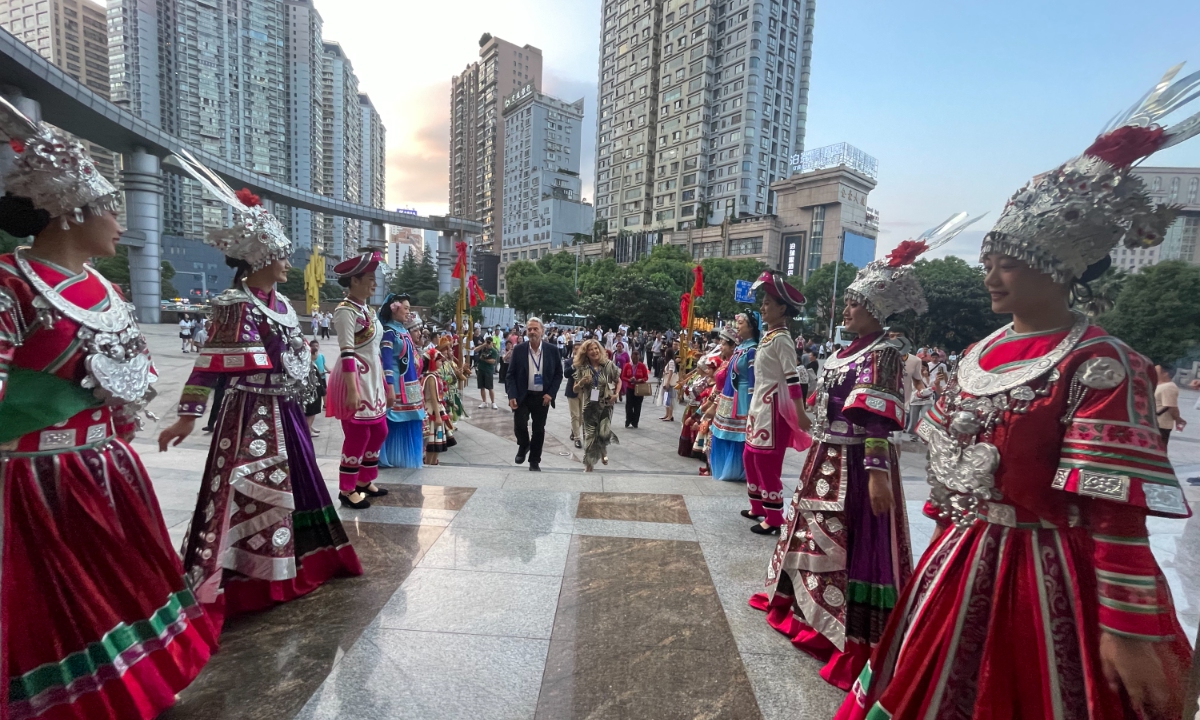 Diplomats from countries including Yemen, Cyprus, Greece, and Malta are welcomed by Miao and other ethnic minorities at the Guiyang Theatre. Photo: Liu Caiyu/GT