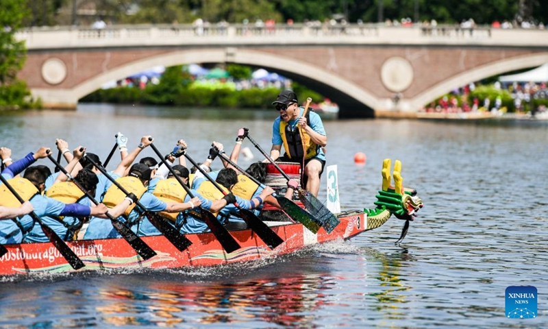 Participants compete at Boston Hong Kong Dragon Boat Festival in Cambridge, Massachusetts, the United States, on June 11, 2023. More than 60 teams took part in this event on Sunday.(Photo: Xinhua)