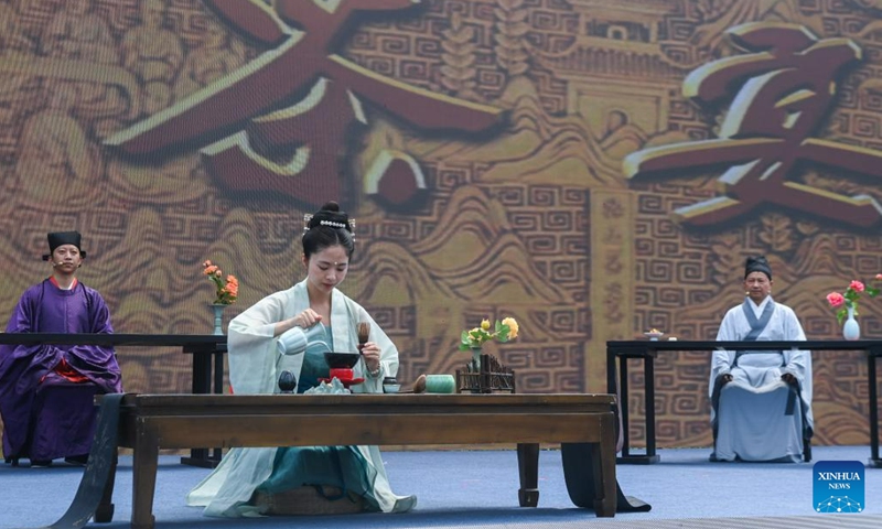Jingshan Tea Ceremony is performed during an activity marking the Cultural and Natural Heritage Day in Hangzhou, east China's Zhejiang Province, June 9, 2023. Hangzhou with its rich cultural heritage and breathtaking natural beauty has established itself as a must-visit city for travel enthusiasts.(Photo: Xinhua)