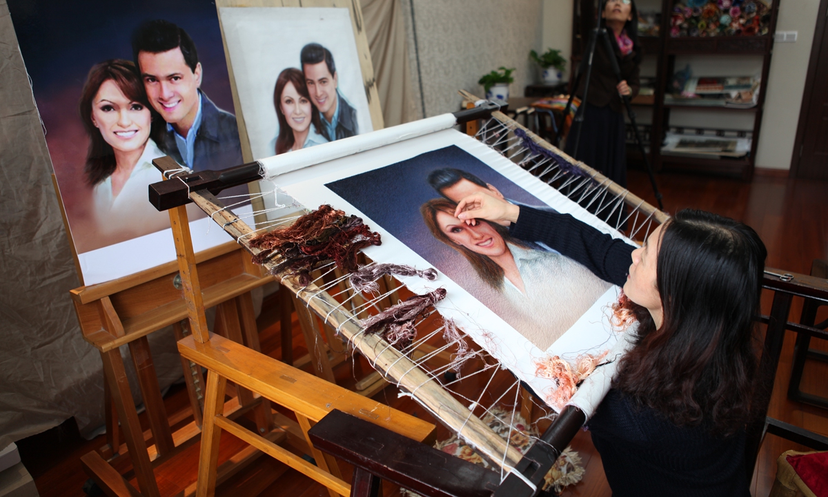 Yao Jianping works on Suzhou Embroidery. Photo: Courtesy of Yao Jianping