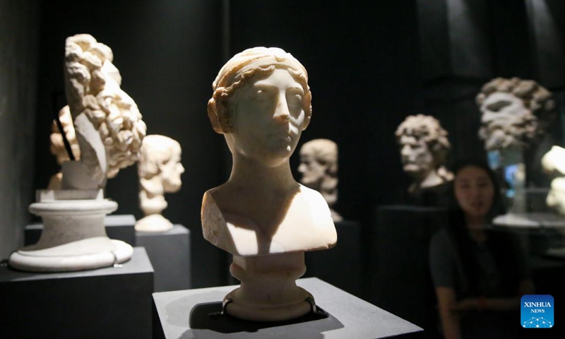 A visitor looks at exhibits during a media preview of an exhibition of ancient Greece and Rome art and culture at the National Museum of Korea in Seoul, South Korea, June 14, 2023. An exhibition of ancient Greece and Rome art and culture was announced on Wednesday at the National Museum of Korea. The exhibition is jointly organized with the Kunsthistorisches Museum in Vienna, Austria, which houses a world-renowned collection of Greek and Rome antiquities.(Photo: Xinhua)