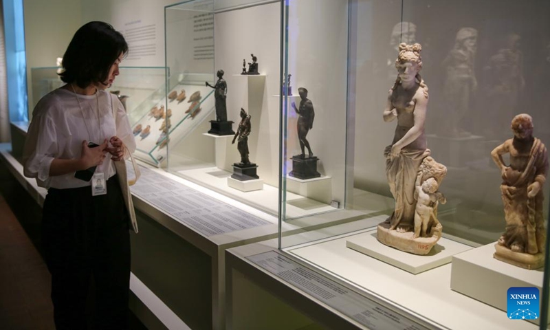A visitor looks at exhibits during a media preview of an exhibition of ancient Greece and Rome art and culture at the National Museum of Korea in Seoul, South Korea, June 14, 2023. An exhibition of ancient Greece and Rome art and culture was announced on Wednesday at the National Museum of Korea. The exhibition is jointly organized with the Kunsthistorisches Museum in Vienna, Austria, which houses a world-renowned collection of Greek and Rome antiquities.(Photo: Xinhua)
