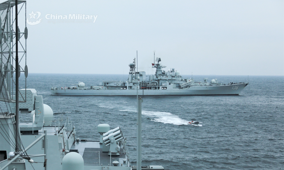 The guided missile destroyer Hangzhou (Hull 136) attached to a naval destroyer flotilla under the PLA Eastern Theater Command conducts temporary inspection, visit, board, search and seizure (VBSS) training with another destroyer during a recent live force-on-force training exercise. (eng.chinamil.com.cn/Photo by Wen Zidong)