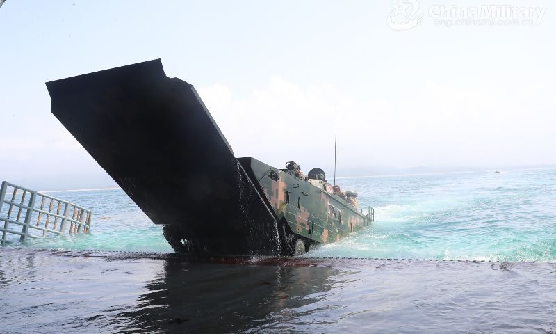 An amphibious infantry fighting vehicle attached to a brigade of the PLA 74th Group Army embarks on the well deck of a landing ship during a recent amphibious assault training exercise. (eng.chinamil.com.cn/Photo by Li Bin)