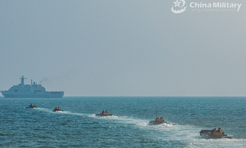 A group of amphibious armored vehicles attached to a brigade of the PLA 74th Group Army maneuver towards designated target area in formation to make their ways to the beach-head during a recent amphibious assault training exercise. (eng.chinamil.com.cn/Photo by Li Bin)
