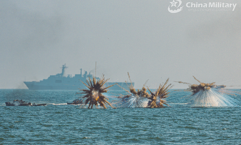 Amphibious armored vehicles attached to a brigade of the PLA 74th Group Army release smoke bombs for concealment during a recent amphibious training exercise. (eng.chinamil.com.cn/Photo by Li Bin)