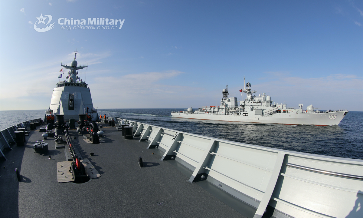 The guided missile destroyer Hangzhou (Hull 136) attached to a naval destroyer flotilla under the PLA Eastern Theater Command sails in formation with another destroyer during a recent live force-on-force training exercise. (eng.chinamil.com.cn/Photo by Wen Zidong)