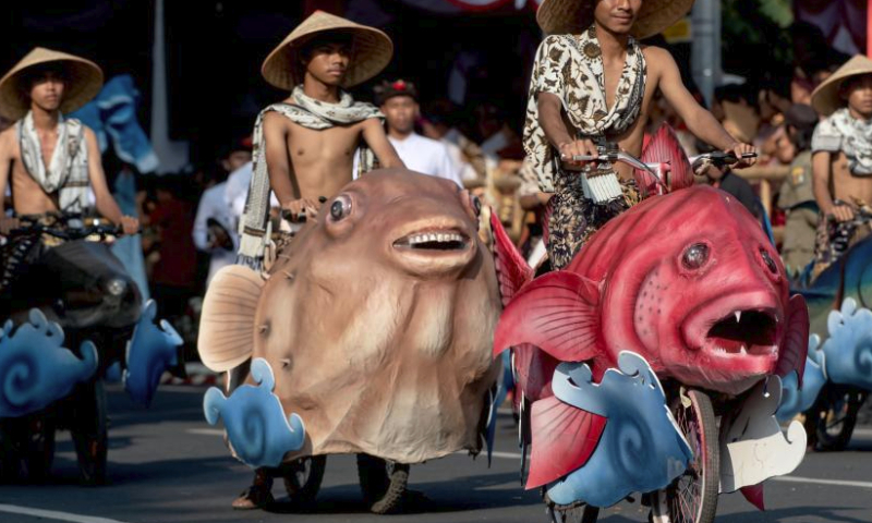 Performers participate in the opening of the 45th Bali Arts Festival in Denpasar, Bali, Indonesia, on June 18, 2023. (Photo by Dicky Bisinglasi/Xinhua)
