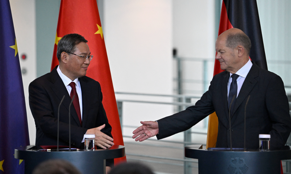 German Chancellor Olaf Scholz (R) and Chinese Premier Li Qiang shake hands after addressing a press conference at the end of German-Chinese economy consultations on June 20, 2023 at the Chancellery in Berlin. Photo: AFP