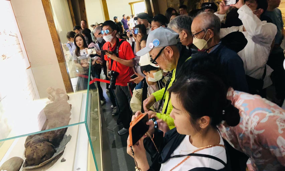 Japanese tourists visit the regional museum on June 20, 2023.