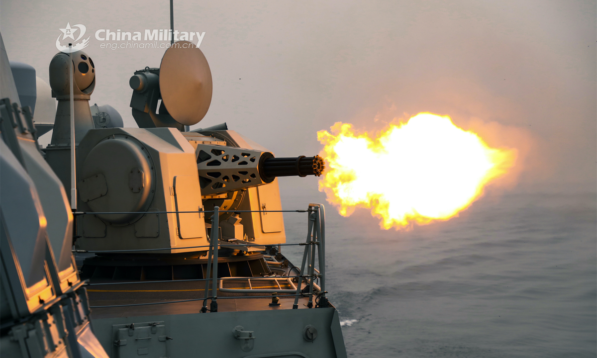 A destroyer attached to a naval destroyer flotilla under the PLA Eastern Theater Command fires its close-in weapon system at mock target during a recent live force-on-force training exercise. (eng.chinamil.com.cn/Photo by Wen Zidong)