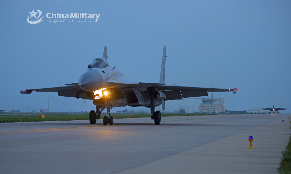 Fighter jets attached to a base under the PLA Naval Aviation University taxi on the runway to get ready for a recent flight training exercise. Photo: China Military
