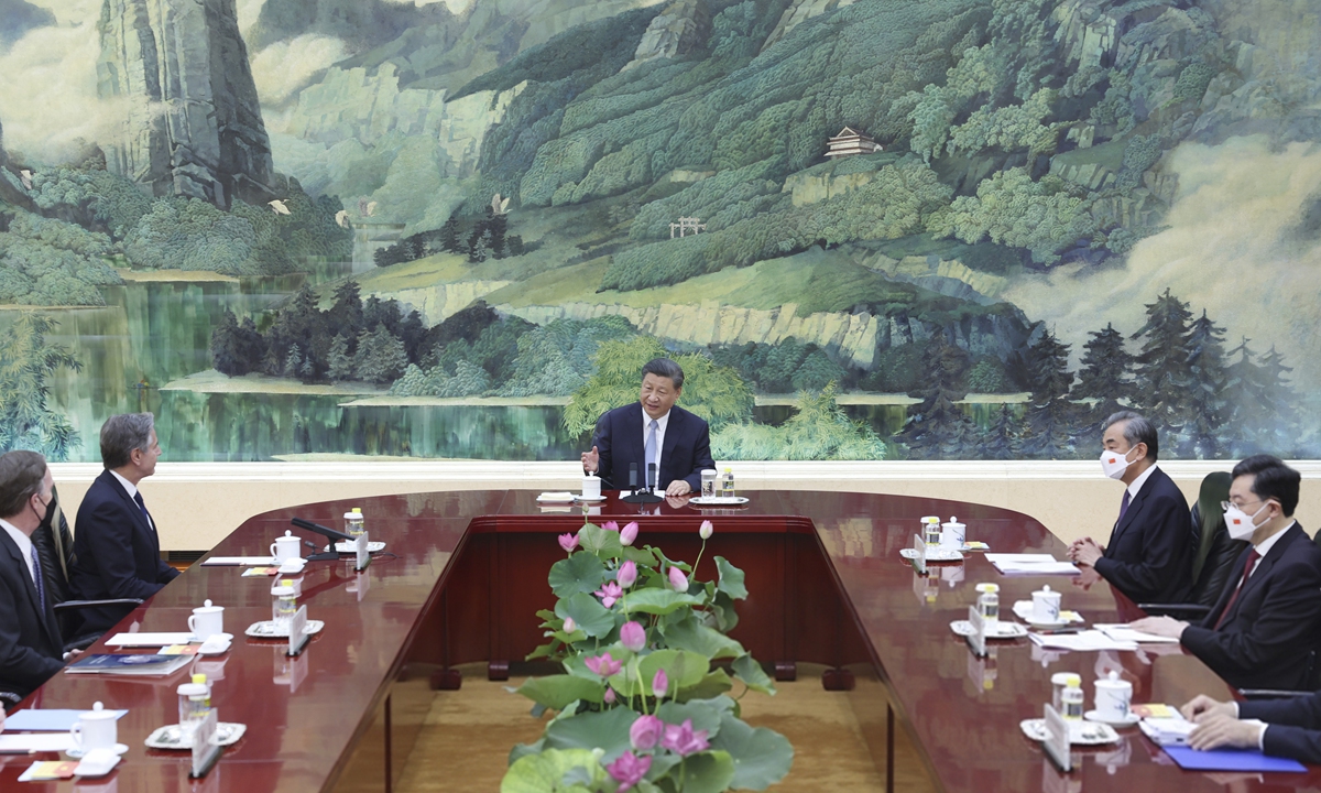 Chinese President Xi Jinping (center) meets with visiting US Secretary of State Antony Blinken in Beijing on June 19, 2023. Blooming lotus ffowers are seen placed in the middle of the meeting table. The Chinese word for 