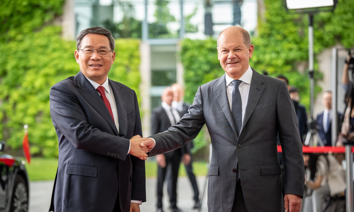 China's Premier Li Qiang (left) shakes hands with German Chancellor Olaf Scholz during a welcoming ceremony on June 20, 2023 in front of the Chancellery in Berlin. Photo: AFP