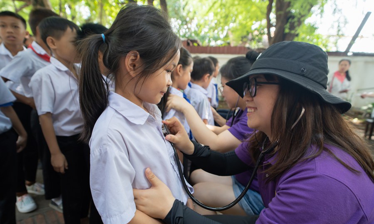 Members of a Chinese medical team carry out congenital heart disease (CHD) screening at a primary school in Luang Prabang, Laos on June 17, 2023. (Photo by Kaikeo Saiyasane/Xinhua)