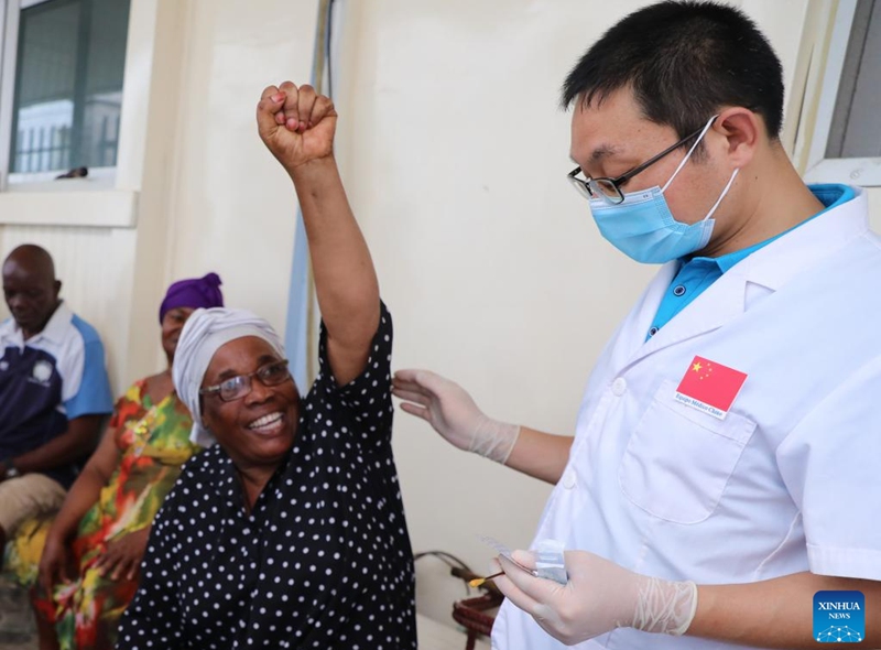 Wu Peiyu, an orthopedist of the Chinese medical team, treats a patient with Traditional Chinese Medicine (TCM) therapy at a hospital in Malabo, Equatorial Guinea, June 14, 2023. Wu Peiyu is a Traditional Chinese Medicine(TCM) orthopedic doctor of the 32nd batch of Chinese medical team stationed in Equatorial Guinea. During the stay of over 10 months, he has already received over 4,000 visits of local patients. (Xinhua/Dong Jianghui)