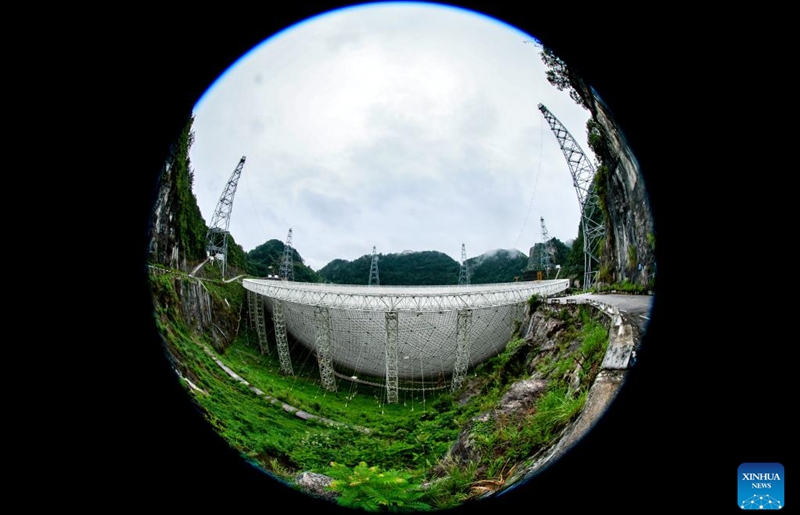 This photo taken with a fish-eye lens on June 22, 2023 shows China's Five-hundred-meter Aperture Spherical Radio Telescope (FAST) under maintenance in southwest China's Guizhou Province. China's FAST telescope identified a binary pulsar with an orbital period of 53.3 minutes, the shortest known period for a pulsar binary system.The research, mainly conducted by a team led by scientists from the National Astronomical Observatories of the Chinese Academy of Sciences (NAOC), was published in the journal Nature Wednesday. (Xinhua/Ou Dongqu)