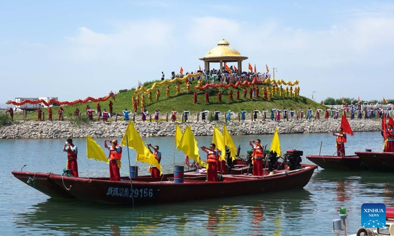 A ceremony is held during the 16th Fishing Festival in the Open Season of Bosten Lake in Bohu County, northwest China's Xinjiang Uygur Autonomous Region, June 23, 2023. Photo: Xinhua