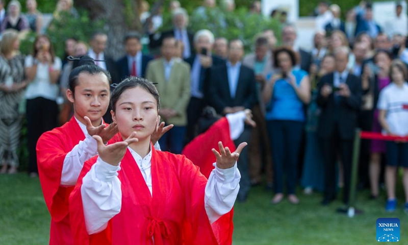 People watch a Taiji (Tai Chi) show at the Chinese embassy in Athens, Greece, on June 22, 2023. The China-Central and Eastern European Countries (CEECs) cooperation was celebrated at a reception held at the Chinese embassy in Athens on Thursday. (Xinhua/Marios Lolos)