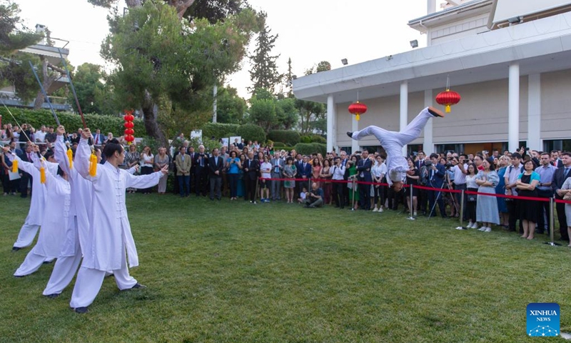 People watch a Chinese Kung Fu show at the Chinese embassy in Athens, Greece, on June 22, 2023. The China-Central and Eastern European Countries (CEECs) cooperation was celebrated at a reception held at the Chinese embassy in Athens on Thursday. (Xinhua/Marios Lolos)
