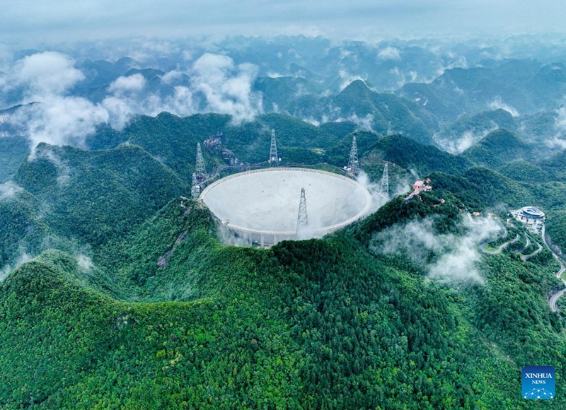 This aerial photo taken on June 22, 2023 shows China's Five-hundred-meter Aperture Spherical Radio Telescope (FAST) under maintenance in southwest China's Guizhou Province. China's FAST telescope identified a binary pulsar with an orbital period of 53.3 minutes, the shortest known period for a pulsar binary system.The research, mainly conducted by a team led by scientists from the National Astronomical Observatories of the Chinese Academy of Sciences (NAOC), was published in the journal Nature Wednesday. (Xinhua/Ou Dongqu)