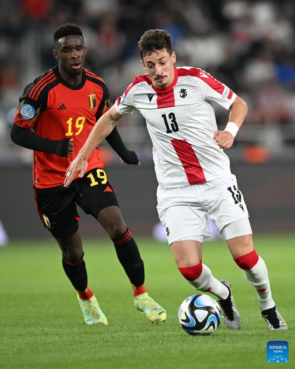 Giorgi Gocholeishvili (R) of Georgia vies with Mandela Keita of Belgium during their group A match of the UEFA U21 Championship in Tbilisi, Georgia, on June 24, 2023. (Photo by Tamuna Kulumbegashvili/Xinhua)