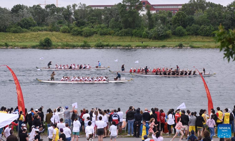People watch the 2023 Vienna Danube Dragon Boat Cup in Vienna, Austria, June. 24, 2023. (Xinhua/He Canling)