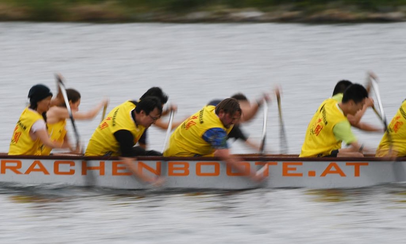 Members of Team AOHUA compete during the 2023 Vienna Danube Dragon Boat Cup in Vienna, Austria, June. 24, 2023. (Xinhua/He Canling)