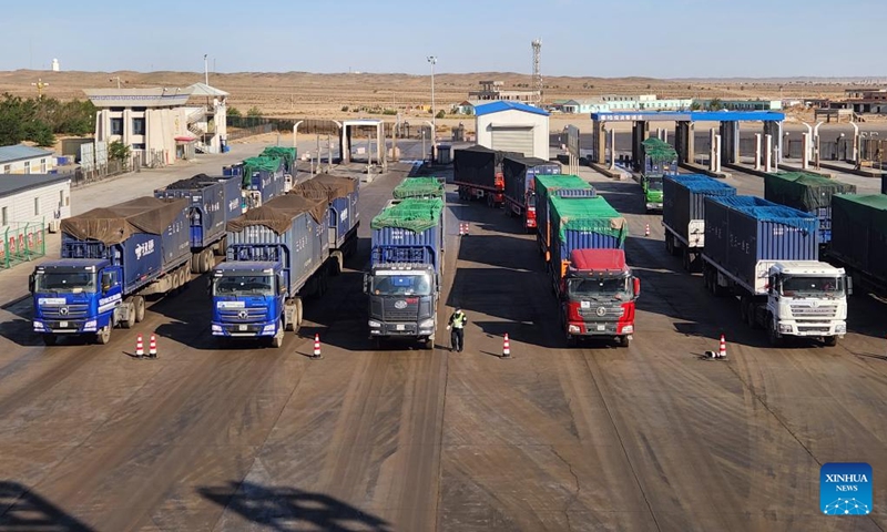 This photo taken on June 21, 2023 shows cargo trucks being inspected at Ganqmod Port in the city of Bayannur, north China's Inner Mongolia Autonomous Region. The daily volume of goods handled by Ganqmod Port, the largest highway port on the China-Mongolia border, has surpassed 170,000 tonnes so far this year, the port administration said Thursday.(Xinhua/Li Yunping)