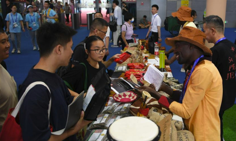 Visitors (L) shop various products at the Changsha International Convention and Exhibition Center during the third China-Africa Economic and Trade Expo in Changsha, central China's Hunan Province, July 1, 2023. The third China-Africa Economic and Trade Expo is held in Changsha from June 29 to July 2. (Xinhua/Chen Zhenhai)