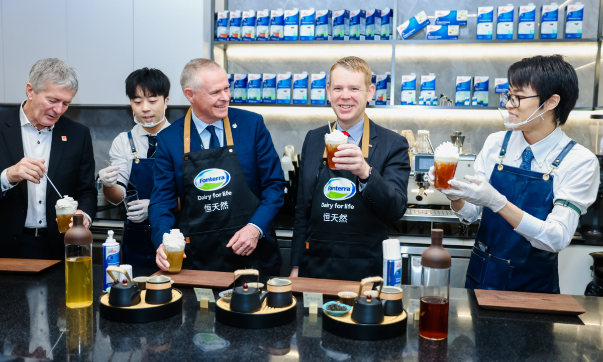 New Zealand Prime Minister Chris Hipkins (second right) and Fonterra Chairman Peter McBride (center) taste Tea Drinks at Fonterra’s Shanghai Application Centre in Shanghai on June 30, 2023. Photo: Courtesy of Fonterra