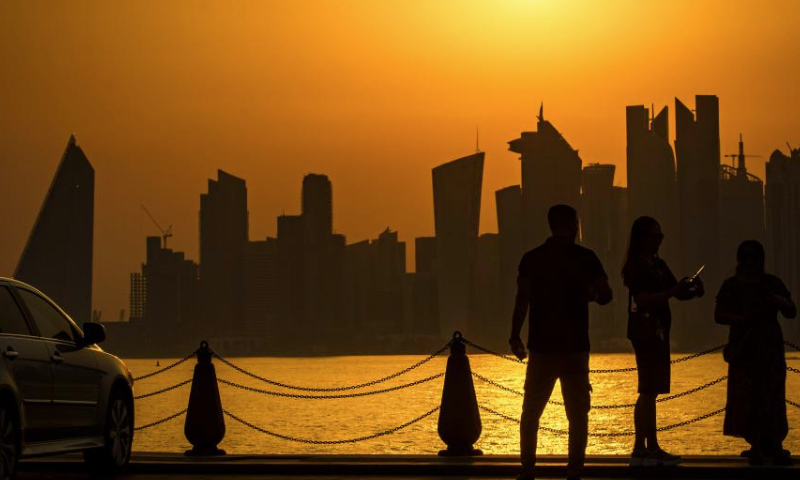 This photo taken on July 6, 2023 shows the Doha skyline at sunset as seen from the old Doha port in Doha, Qatar. (Photo by Nikku/Xinhua)
