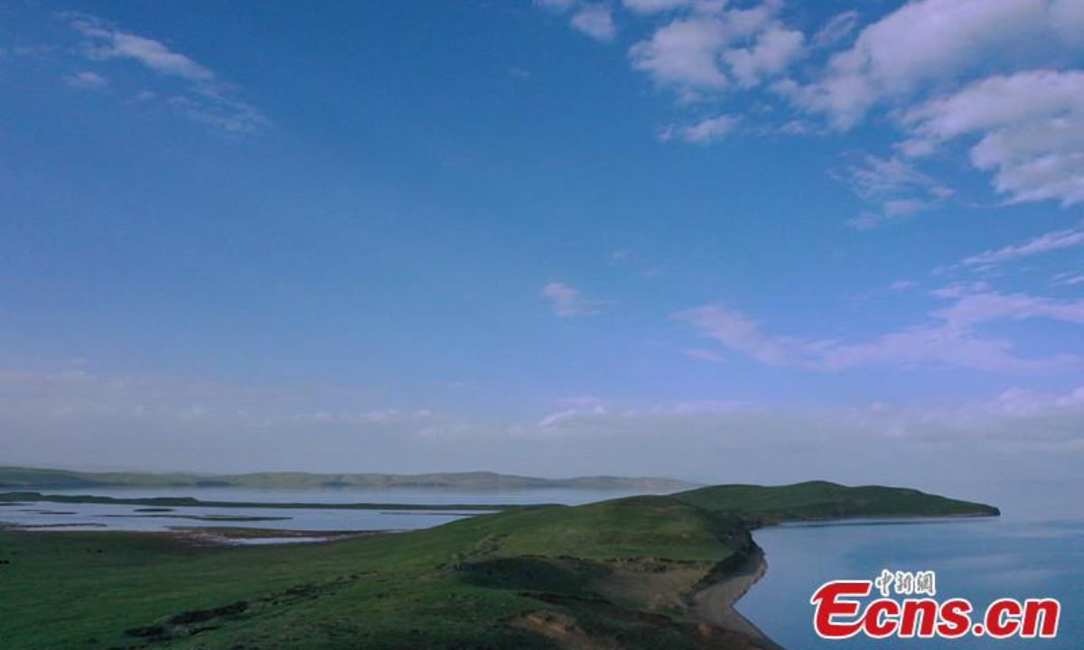 Magnificent scenery of blue colors of the Erling Lake and the sky merging on the horizon at Maduo County of Guoluo Tibetan Autonomous Prefecture, northwest China's Qinghai Province, June 28, 2023.