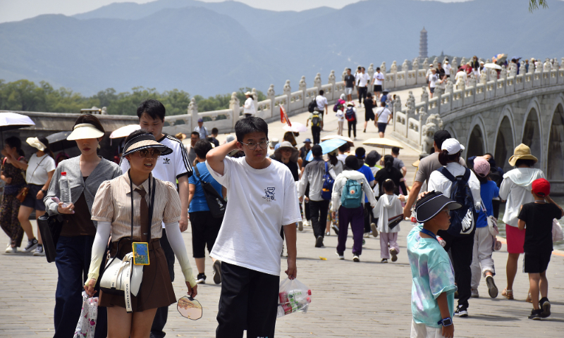 Tourists are seen in the Summer Palace in Beijing on July 1, 2023. Photo: VCG