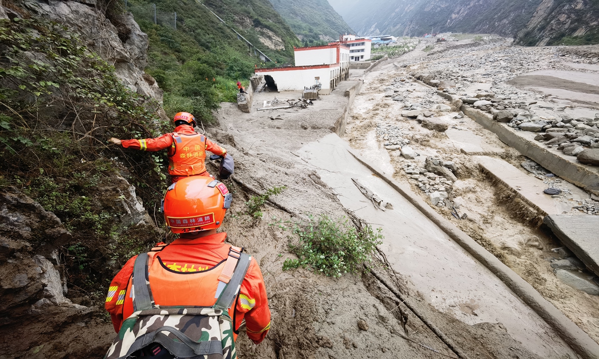 Fire crews from Aba Tibetan and Qiang Autonomous Prefecture conduct rescue operations in Wenchuan county in Southwest China’s Sichuan Province on June 27, 2023. Photo: VCG