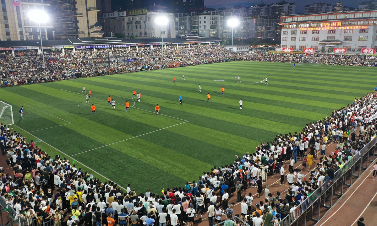 People watch a Cun Chao soccer match in Rongjiang county, Southwest China's Guizhou Province, on June 3, 2023. Photos: VCG