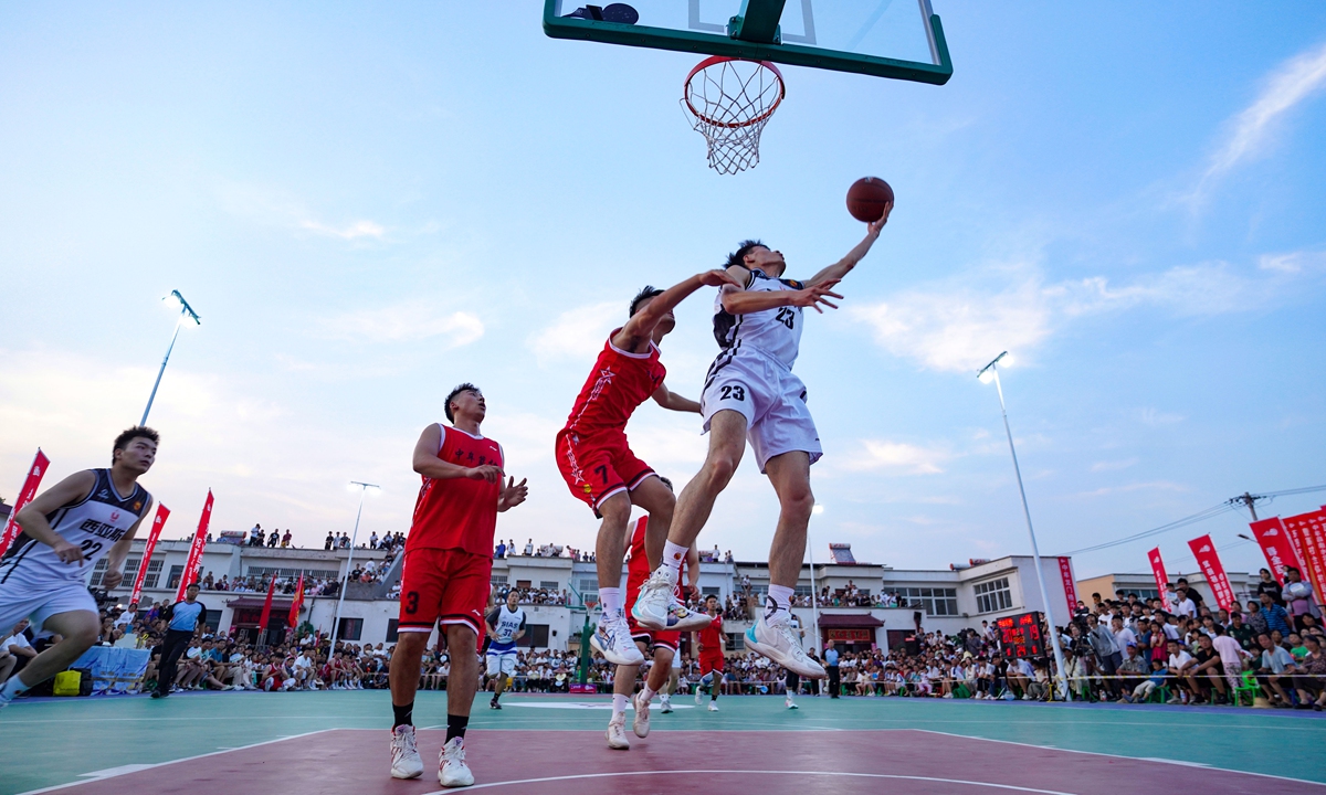 A player goes for a layup in a village basketball match in Zhongmou county, Central China's Henan Province, on June 24, 2023. Photo: VCG