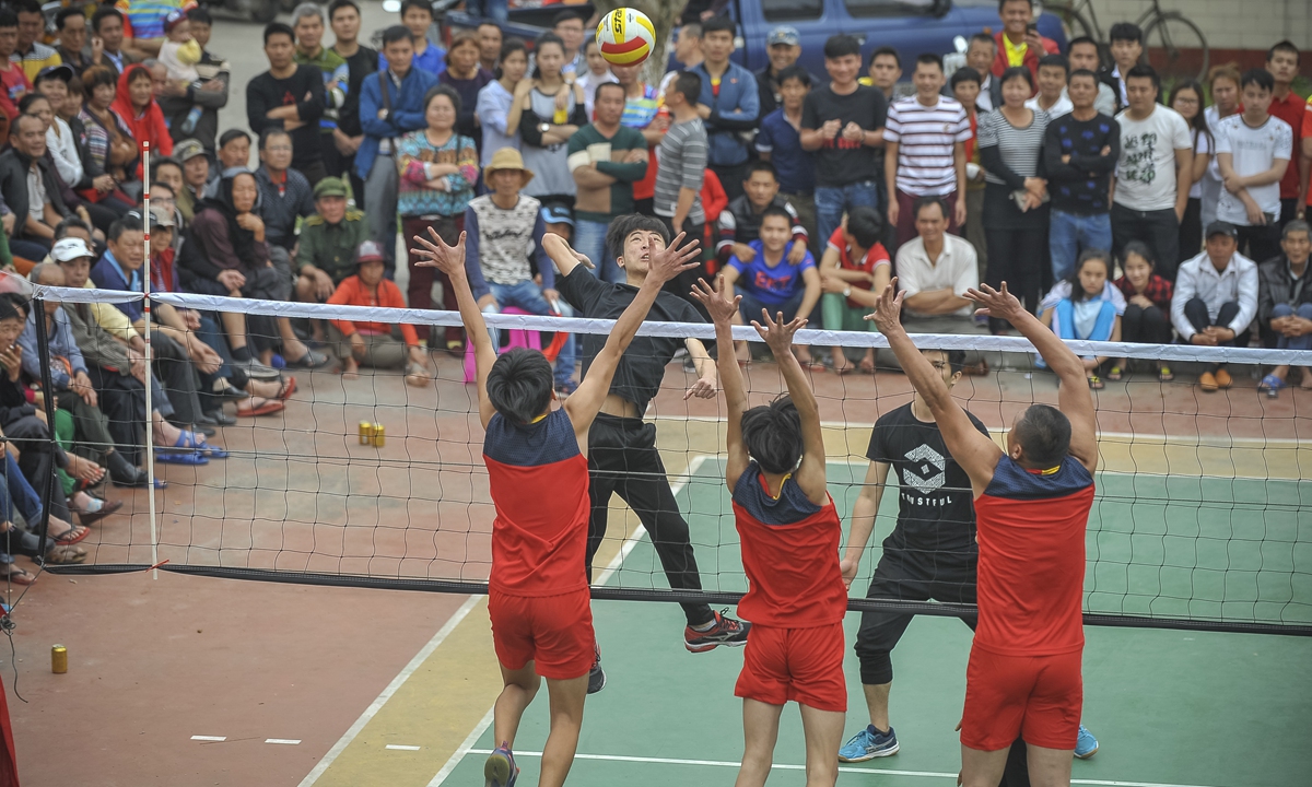 Villagers compete in a volleyball match in Wenchang, South China's Hainan Province. Photo: VCG