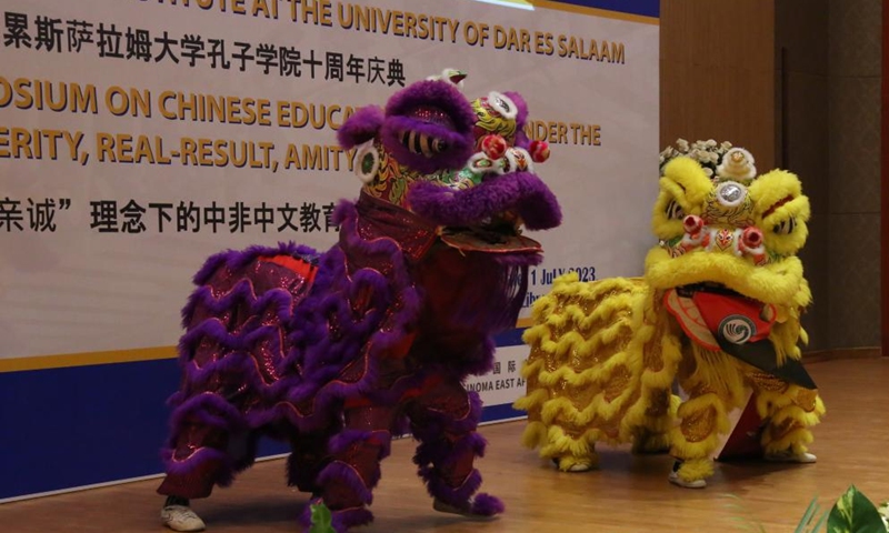 Students perform a lion dance at the 10th-anniversary celebration of the Confucius Institute at the University of Dar es Salaam in Dar es Salaam, Tanzania, on July 1, 2023. The Confucius Institute at the University of Dar es Salaam in Tanzania on Saturday celebrated its 10th anniversary. Government officials, Chinese diplomats in Tanzania, representatives from Confucius institutes and Chinese companies in the country attended the ceremony.  (Photo by Herman Emmanuel/Xinhua)