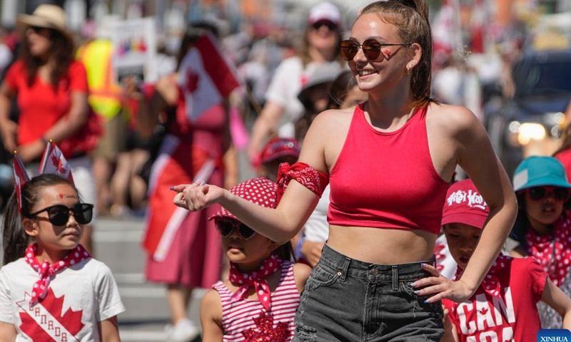 Participants dance during the Salmon Festival Parade in Richmond, British Columbia, Canada, on July 1, 2023. (Photo by Liang Sen/Xinhua)