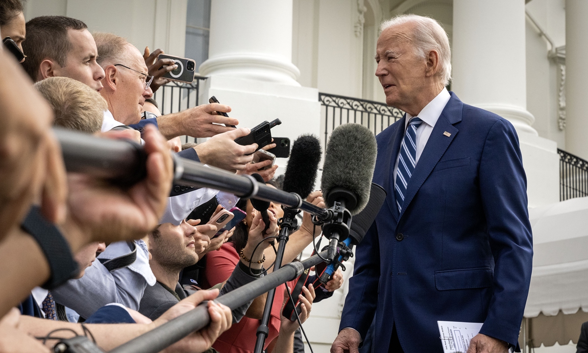 US President Joe Biden talks to reporters as he leaves the White House en route to Chicago in Washington, DC on June 28, 2023. Biden was seen by reporters on Wednesday with marks on his face, which the White House later explained were from the mask that he was using that helps him breathe at night. Photo: VCG