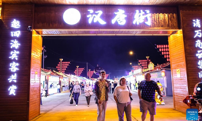 
Russian tourists visit a night market in Hunchun, northeast China's Jilin Province, June 27, 2023. Hunchun, a city with about 220,000 residents, is located at China's border with Russia and the Democratic People's Republic of Korea. The resumption of passenger services by the Hunchun customs at the start of 2023 has made it convenient for Russian tourists who visit the city for shopping, entertainment and food experiences. (Photo:Xinhua)