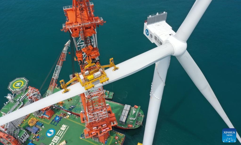 This aerial photo shows the construction site of the world's first 16-megawatt offshore wind turbine in Fuzhou, southeast China's Fujian Province, June 28, 2023. The construction of the giant offshore wind turbine, with the world's largest per-unit capacity, was completed here on Wednesday, according to China Three Gorges Corporation. (Photo:Xinhua)