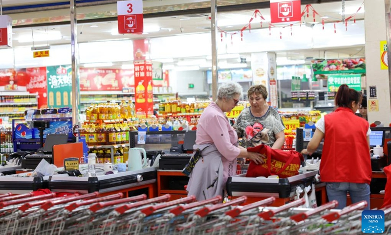 
Russian tourists visit a supermarket in Hunchun, northeast China's Jilin Province, June 27, 2023. Hunchun, a city with about 220,000 residents, is located at China's border with Russia and the Democratic People's Republic of Korea. The resumption of passenger services by the Hunchun customs at the start of 2023 has made it convenient for Russian tourists who visit the city for shopping, entertainment and food experiences. (Photo:Xinhua)