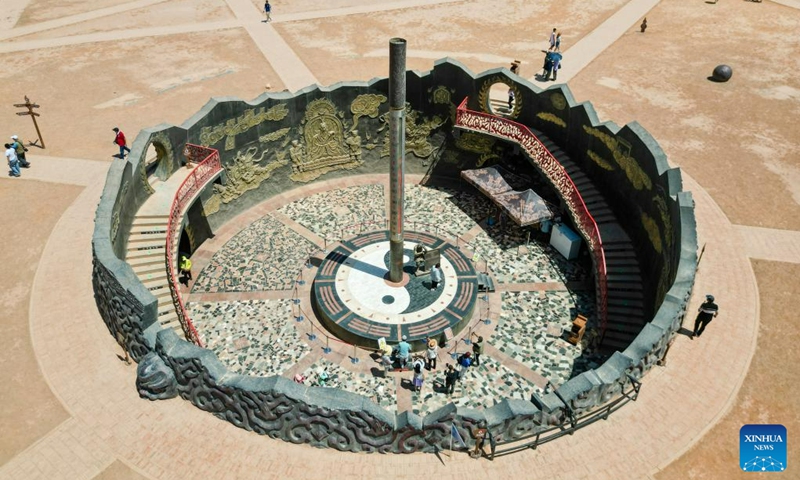 In this aerial photo, tourists visit the Flaming Mountain scenic area in Turpan, northwest China's Xinjiang Uygur Autonomous Region, June 27, 2023. The city of Turpan has received 2.53 million tourist visits from June 1 to 28, an increase of nearly 40 percent over the same period in 2022. (Photo: Xinhua)