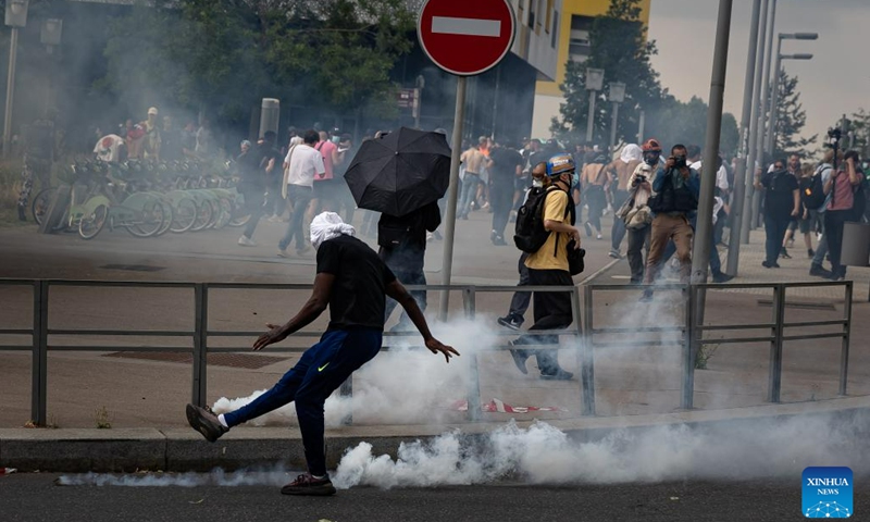 A man kicks back a tear gas canister fired by security forces during a protest in Nanterre, a town on the western outskirts of Paris, France, on June 29, 2023.(Photo: Xinhua)