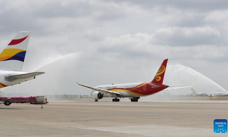 Hainan airlines HU760 flight receives a water salute before taking off for Shenzhen at Brussels Airport in Zaventem, Belgium, June 28, 2023. A ceremony was held for China's Hainan airlines at Brussels Airport on Wednesday to mark the resumption of its Brussels-Shenzhen direct flights.(Photo: Xinhua)